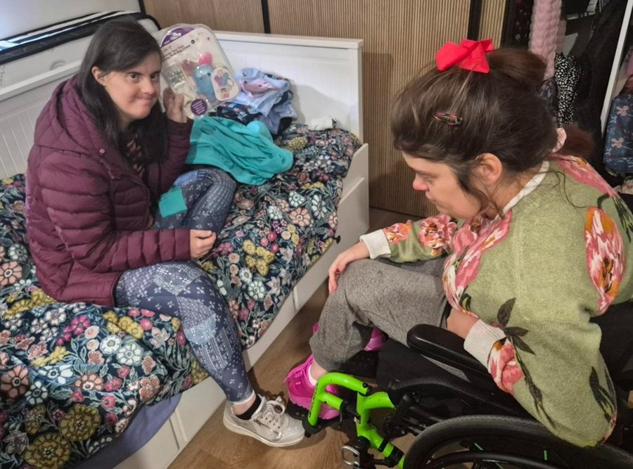A support worker helping a participant at home